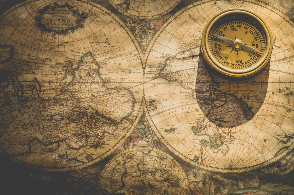 A compass sits on an old map of the world